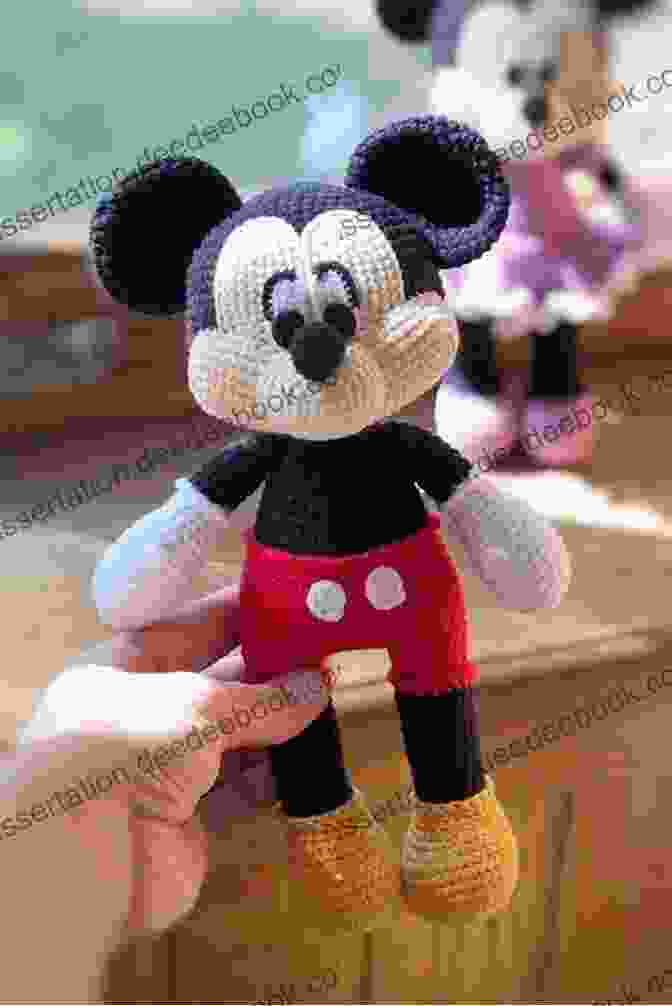 A Vibrant Array Of Crocheted Disney Characters, Including Mickey Mouse, Minnie Mouse, Donald Duck, And Stitch. The Disney Crochet Book: Crochet Your Favorite Disney Characters With Instructions